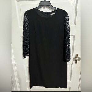 Elegant Black Dress with Embroidered Sleeves